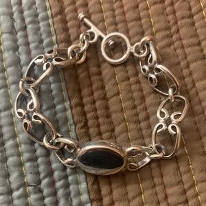 Sterling Silver Interlocking horseshoe/vine link signet ring.